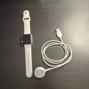 Apple Watch series 3 one left wich has the white band